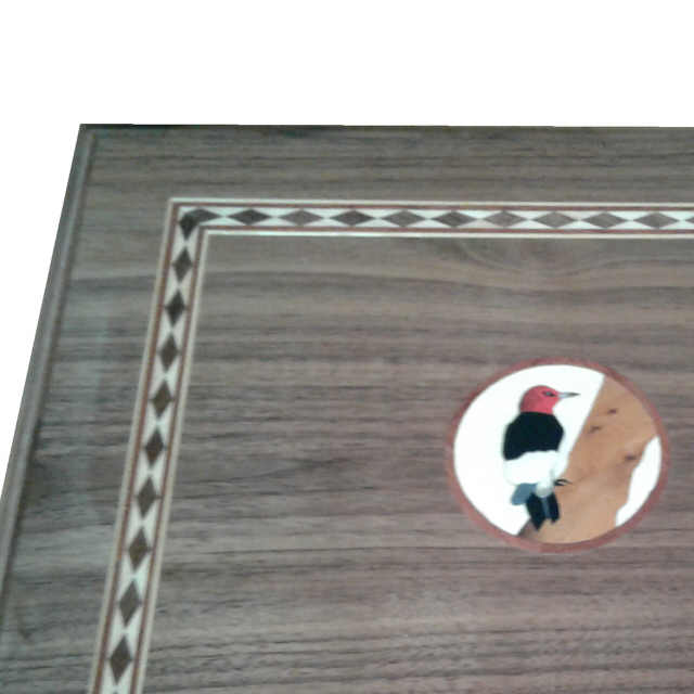 Box with marquetry logo
