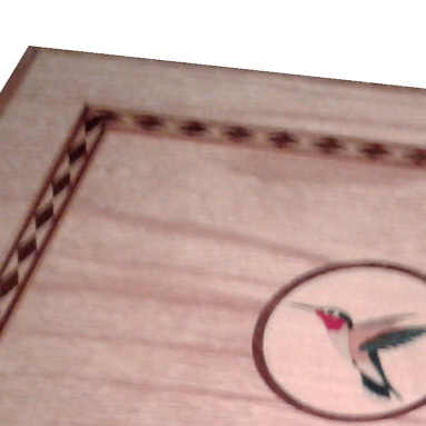 Box with marquetry logo