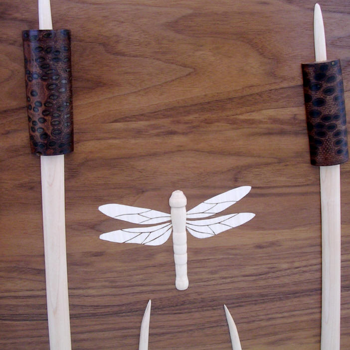 bed in American black walnut with turned reeds and dragonflies