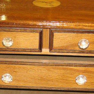 Restored chest with marquetry logo
