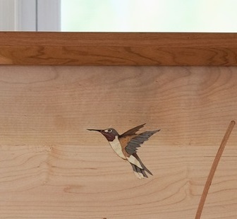 bead head with inlaid humminbird design