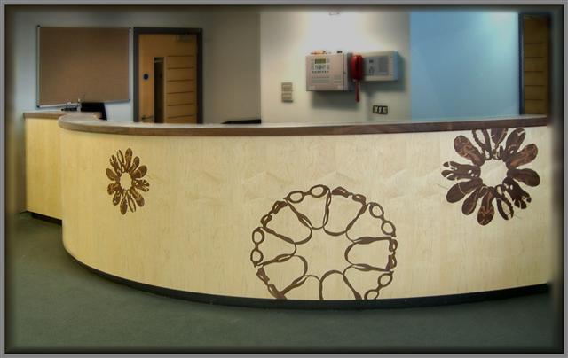 large reception desk with marquetry design