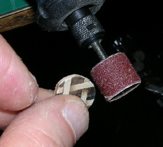 close-up of hands working on marquetry jewellery